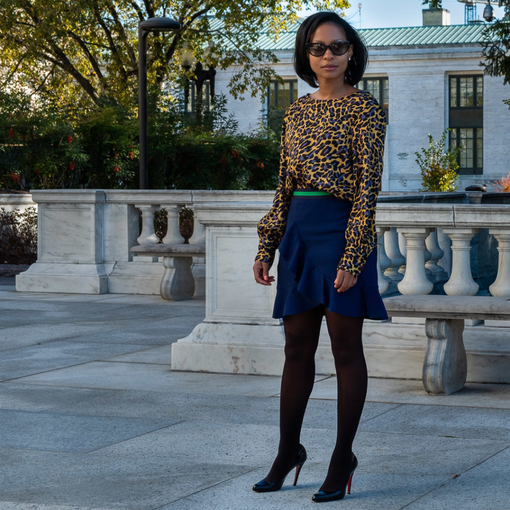 Full image of leopard print top and blue ruffle skirt and Christian Louboutin heels.